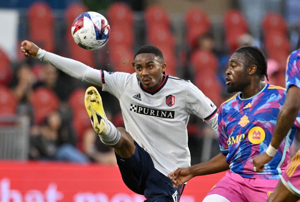 St. Louis City defender Njabulo Blom plays the ball against Toronto FC 