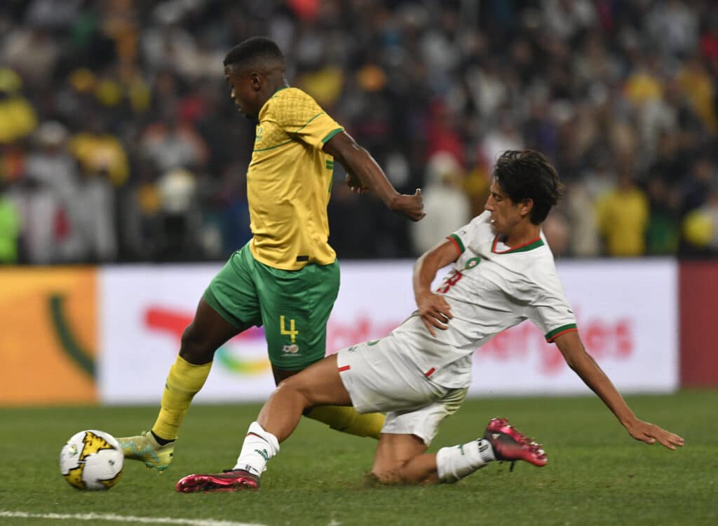Teboho Mokoena - Salary, stats, wife, net worth 2 Teboho Mokoena of South Africa challenged by Youssef Maleh of Morocco during the 2023 Africa Cup of Nations Qualifiers