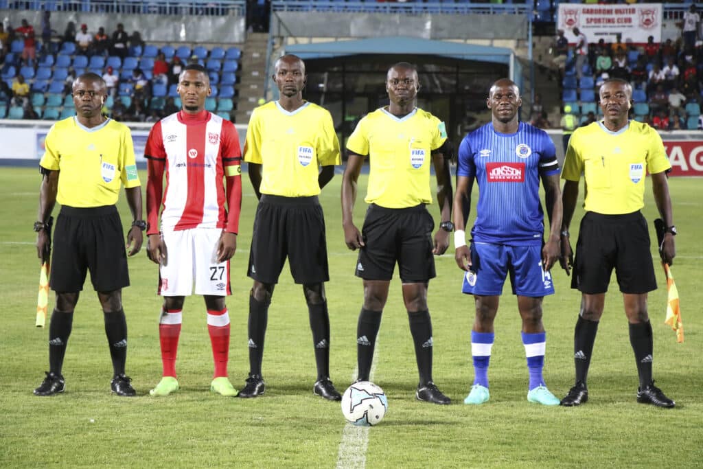 Mpho Kgaswane, Referee Malala Kabanga Yannick and Onismor Bhasera of Supersport United during the CAF Confederation Cup
