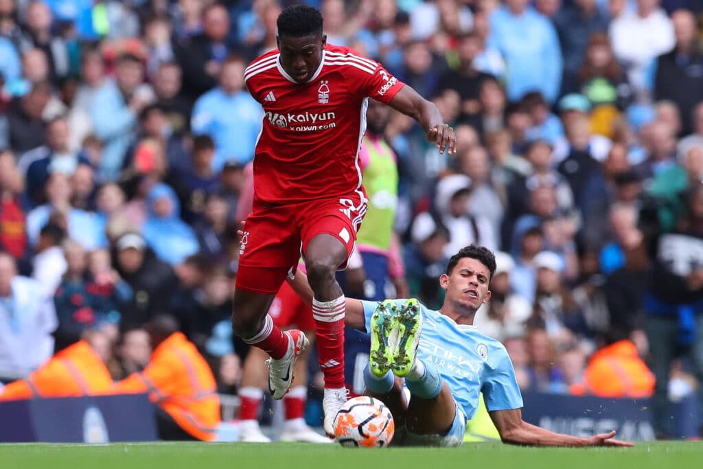 Taiwo Awoniyi of Nottingham Forest evades a tackle by Matheus Nunes