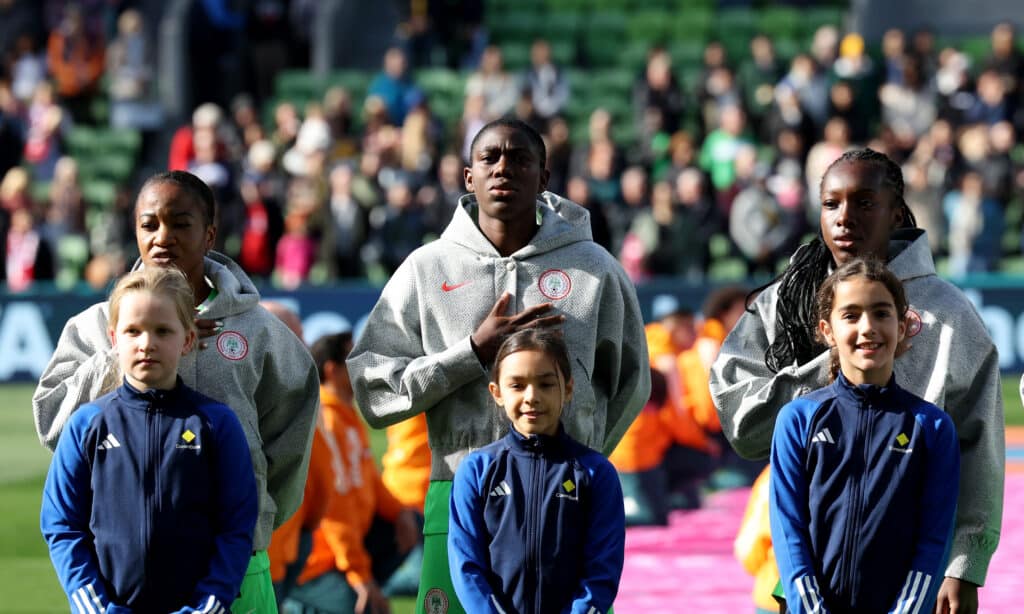 Asisat Oshoala (back C) of Nigeria lines up with her teammates ahead 